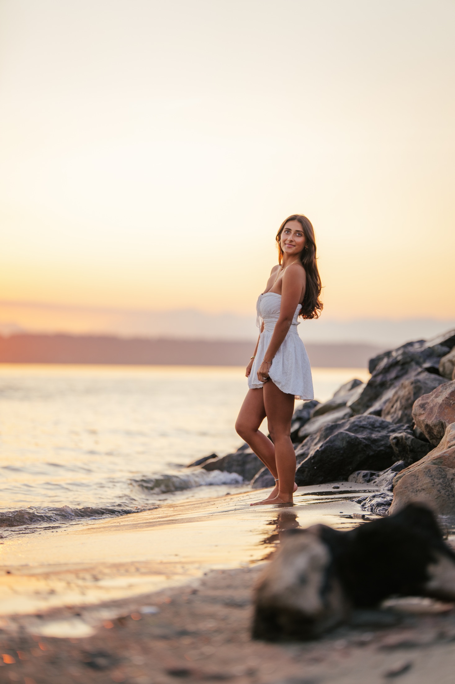 Full-length shoreline portrait in warm sunset light
