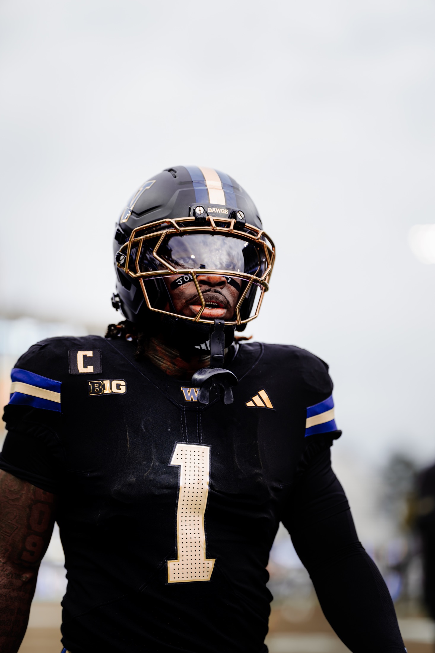Close portrait of a Washington captain in black uniform and gold helmet